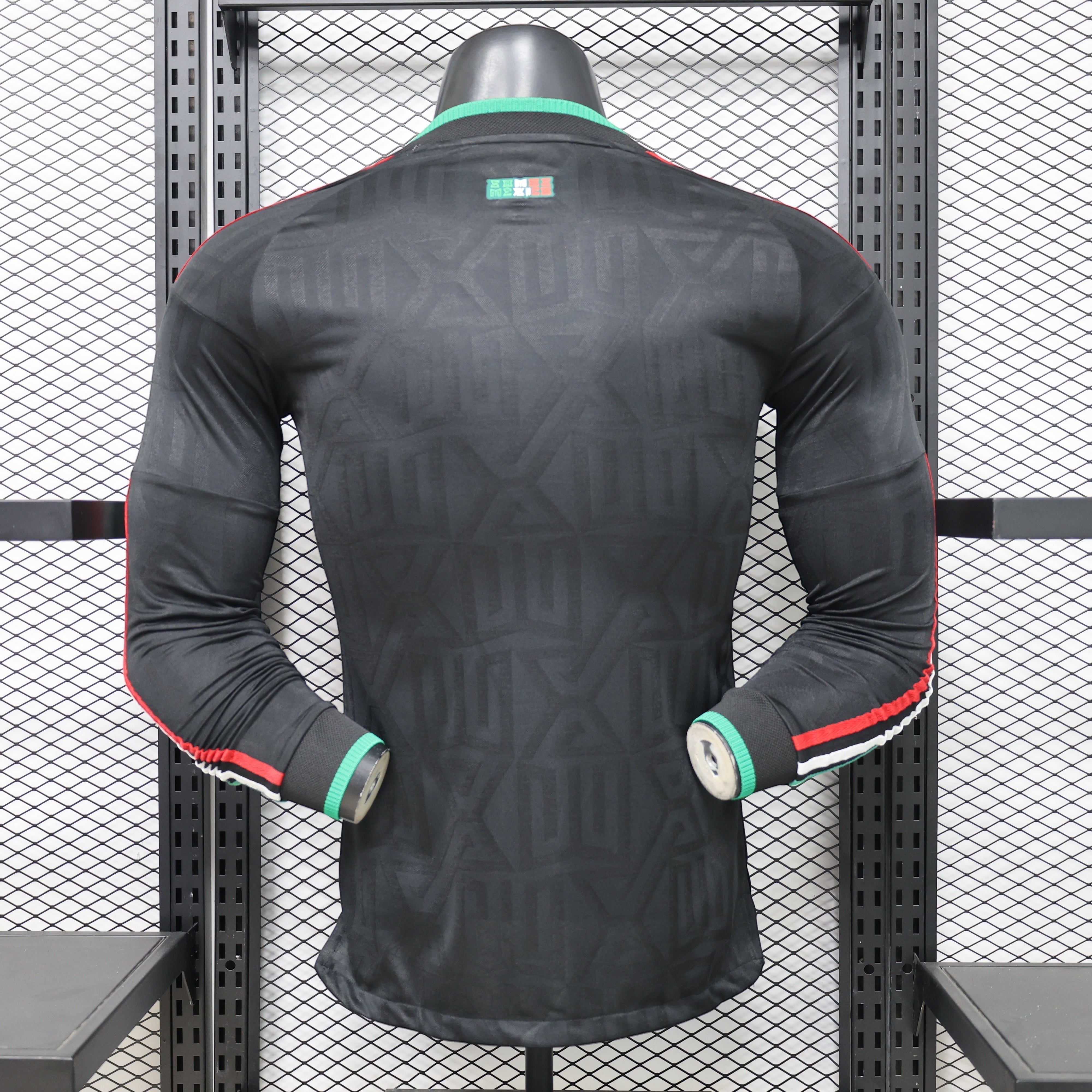 Leazofoot black long sleeve Mexico soccer jersey with green and red trim on cuffs and collar.