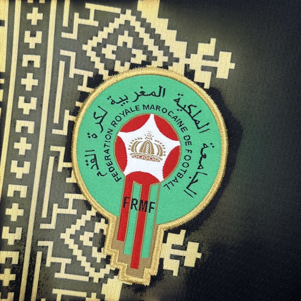 Leazofoot Morocco 2026 concept football jersey featuring the embroidered FRMF crest on a black patterned fabric.