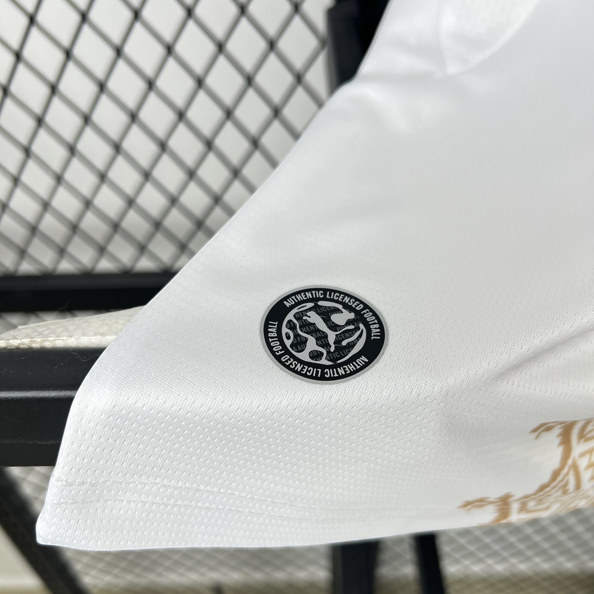 Leazofoot white football jersey with gold geometric pattern and authentic licensed football patch.