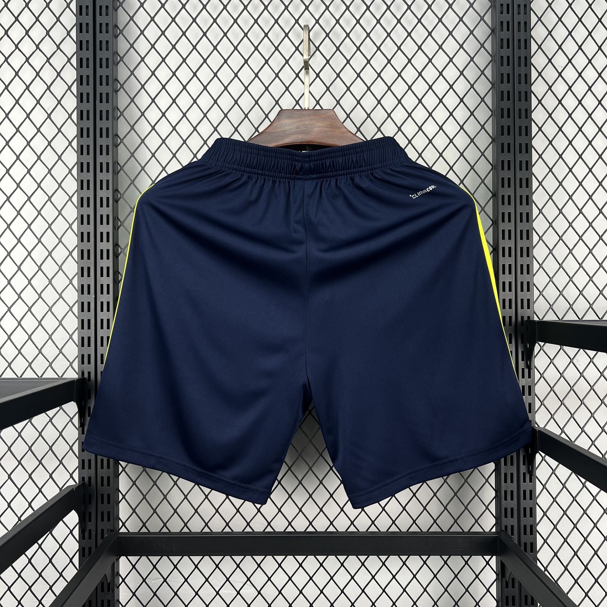 Leazofoot navy blue athletic shorts with yellow side stripes and elastic waistband.