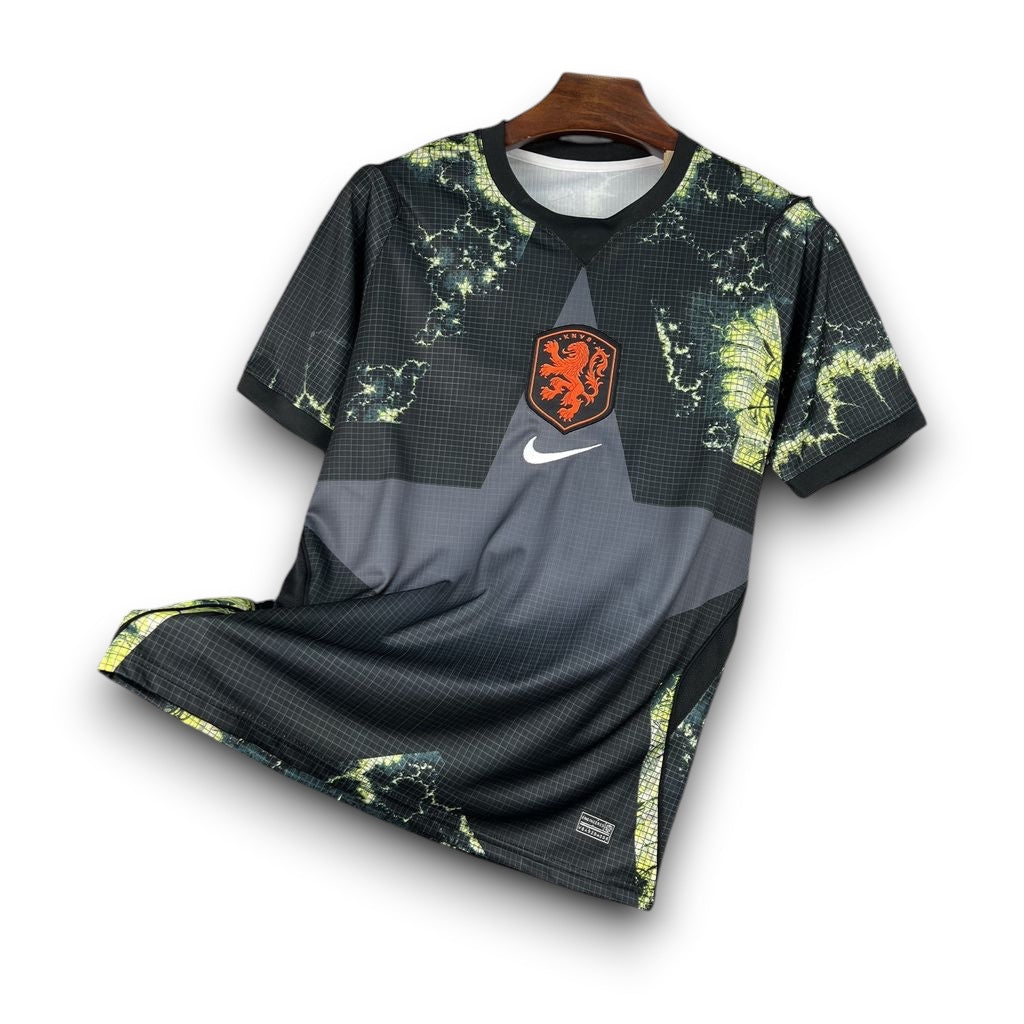 Leazofoot Netherlands 2026 goalkeeper jersey in black with a green graphic pattern and orange KNVB lion crest.