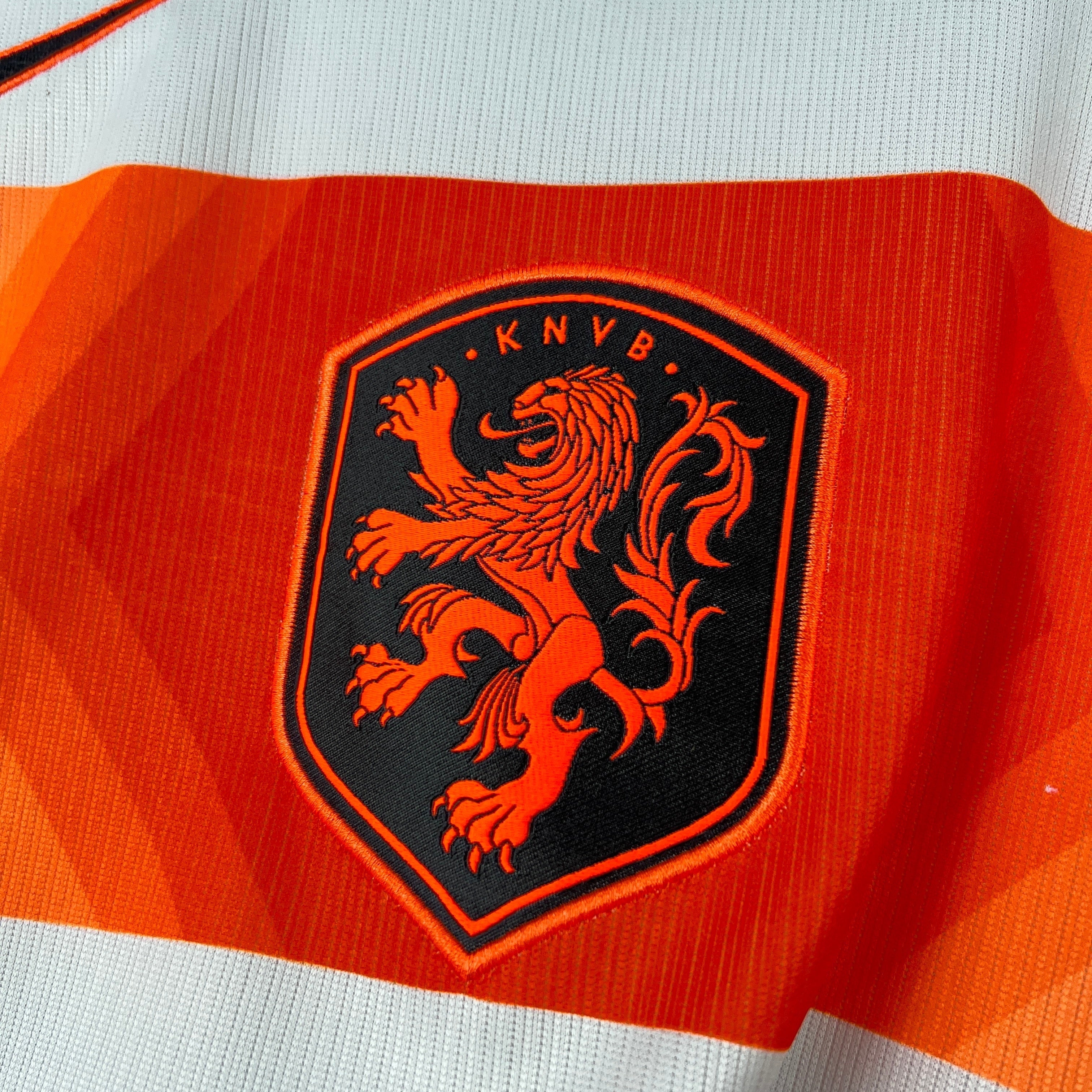 Leazofoot Netherlands away football shirt 2026 with KNVB lion crest. Orange and white.