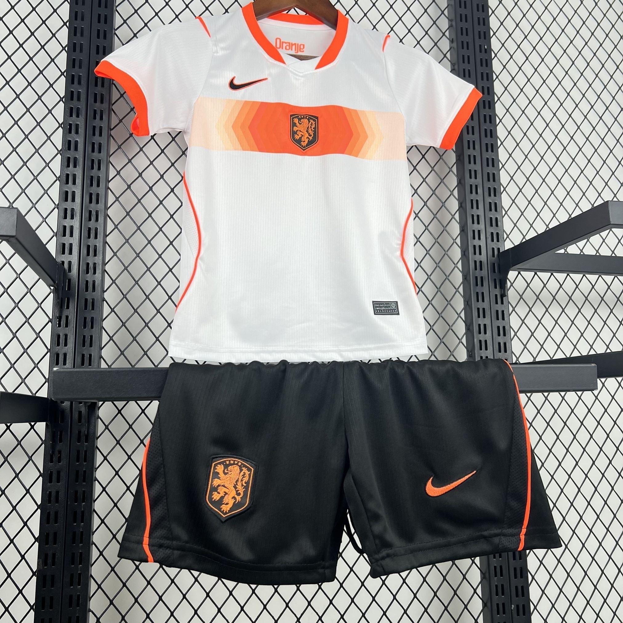 Leazofoot white and orange Netherlands football kit for kids, featuring a jersey with a crest and shorts with a Nike logo.