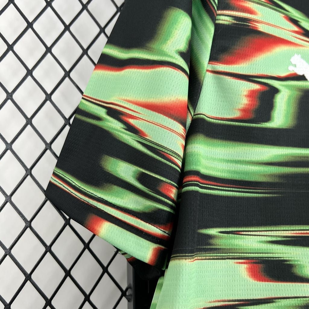 Leazofoot Portugal 2025 pre-match jersey in black, green, and red with a dynamic abstract graphic print.