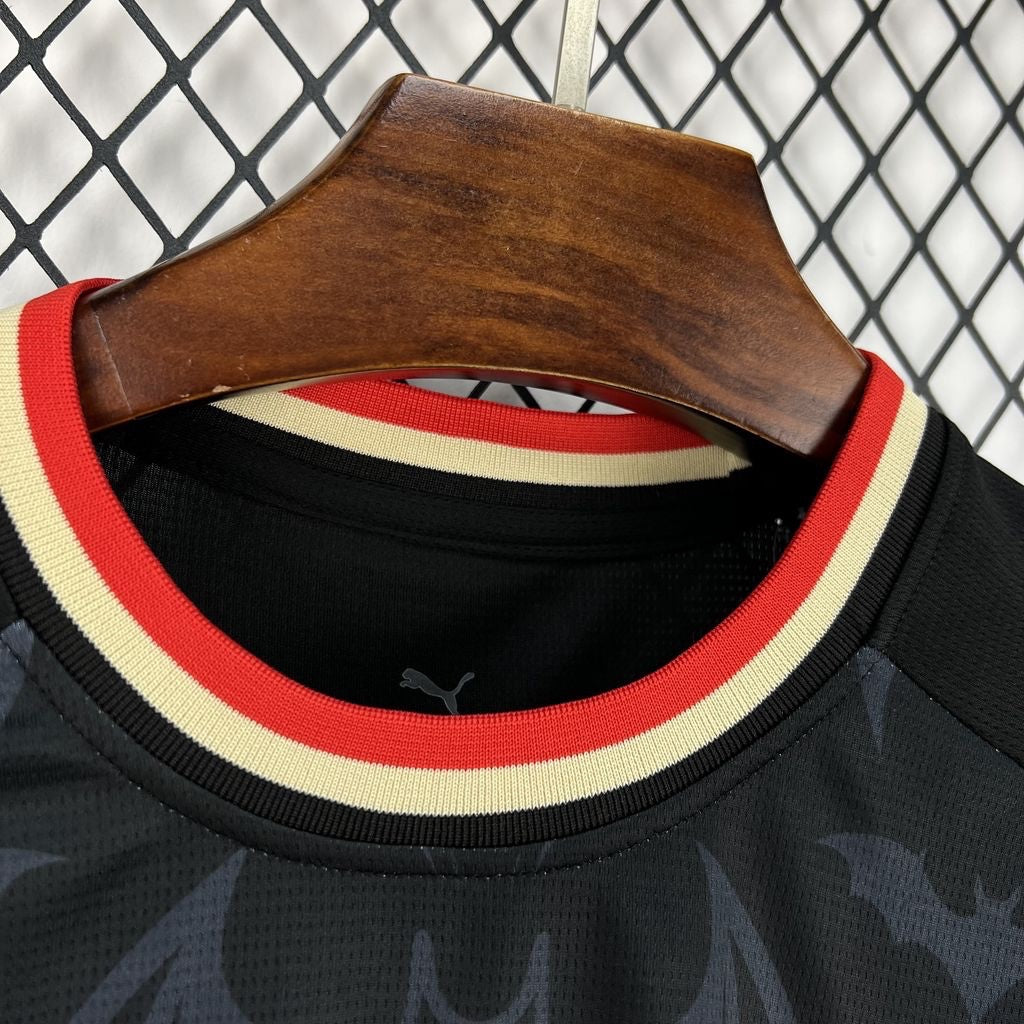 Leazofoot Portugal 2026 concept soccer jersey featuring a black fabric with bat pattern and red and cream trim collar.