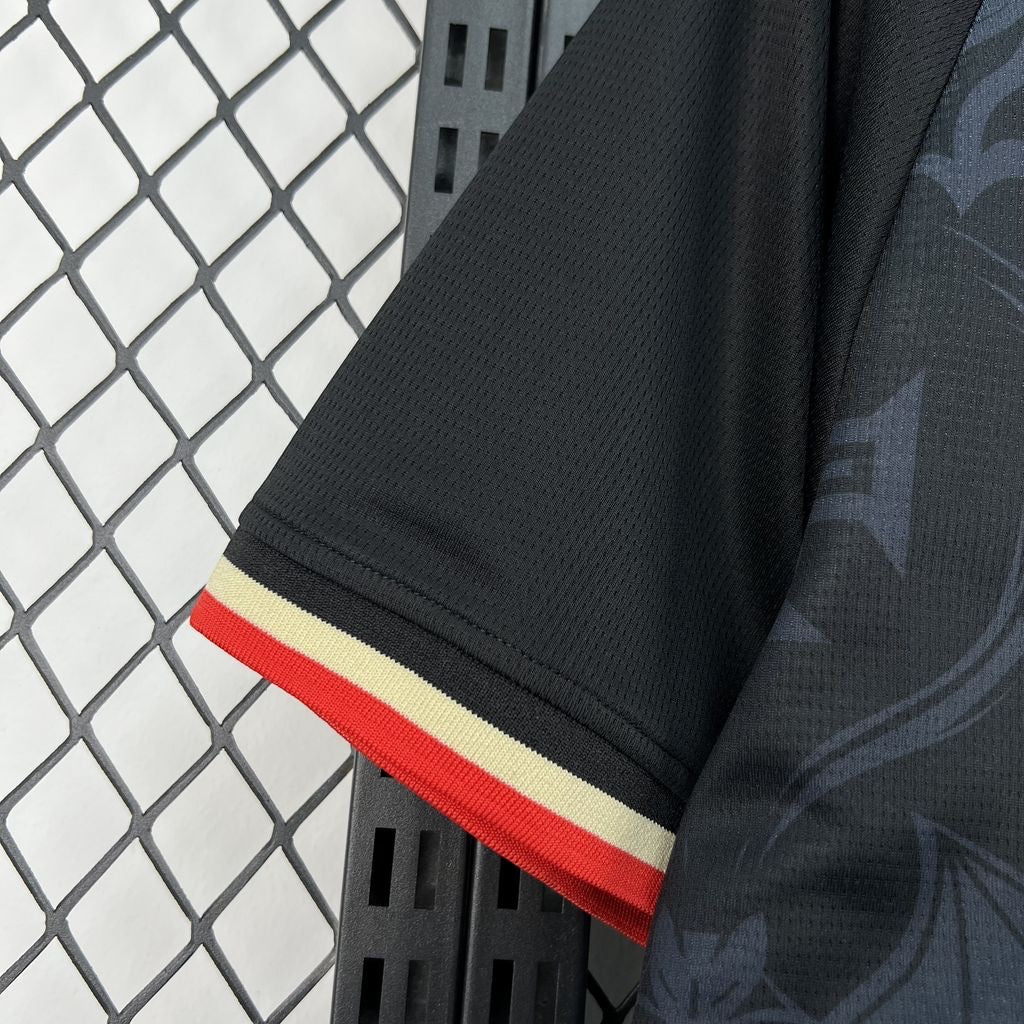 Leazofoot Portugal 2026 concept jersey sleeve in black with red and cream striped trim and subtle patterned fabric.