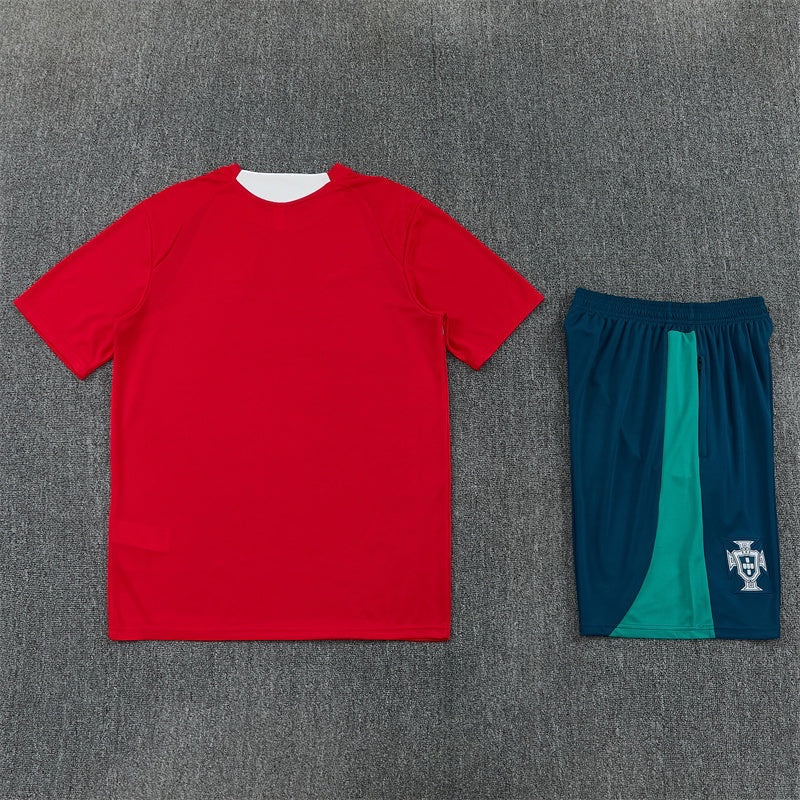 Leazofoot Portugal 2026 training kit featuring a plain red short-sleeve jersey and dark blue shorts with green accents.