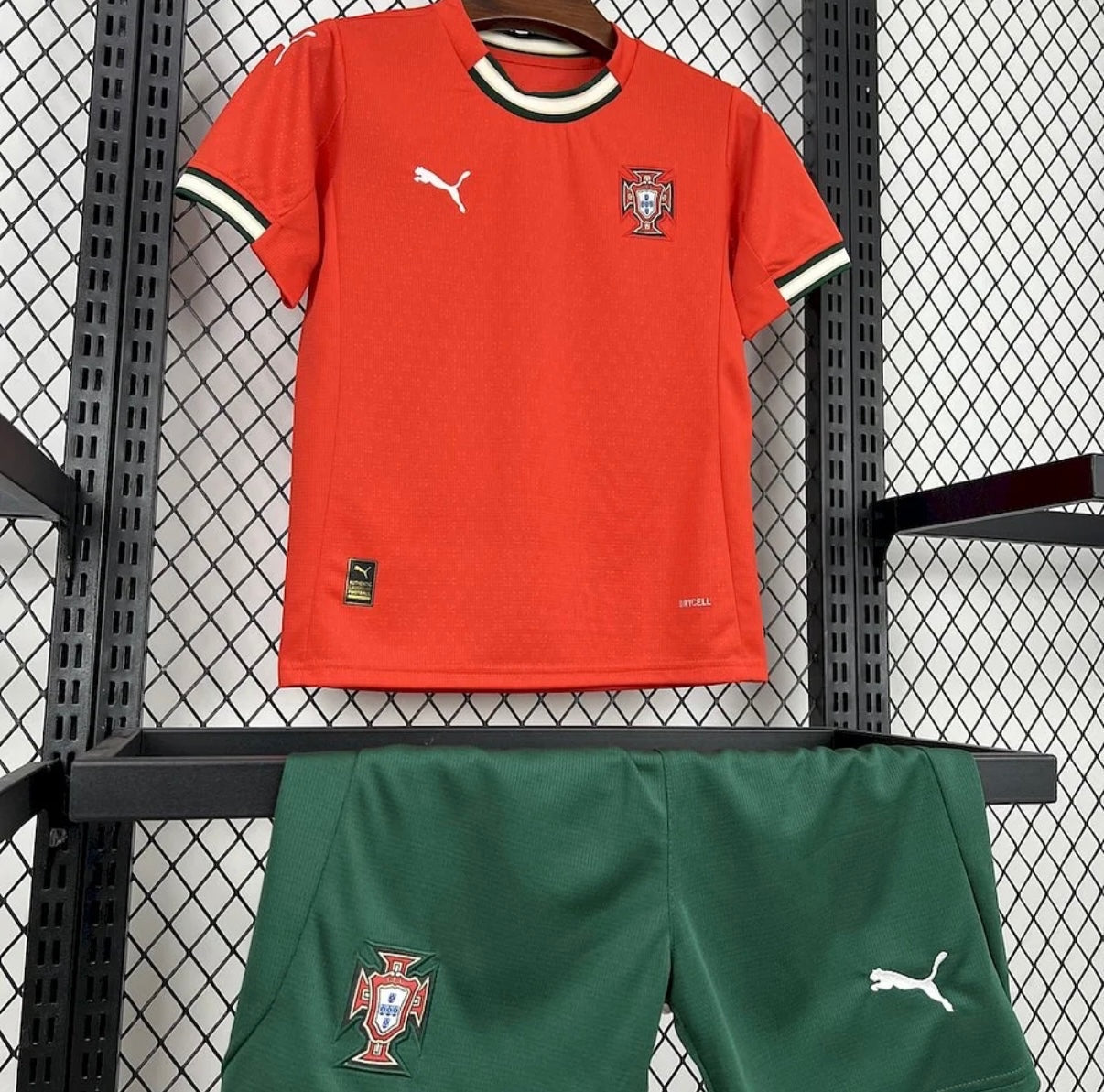 Leazofoot Portugal 2025 kids home kit featuring a red jersey with green trim and green shorts with team crests.