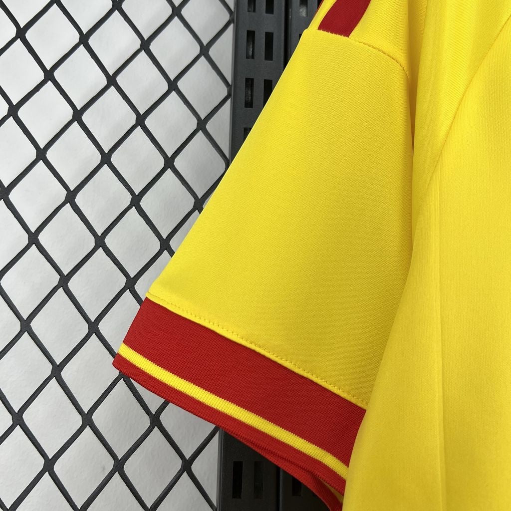 Leazofoot RC Lens 26/27 home jersey sleeve featuring bright yellow fabric with red and yellow striped trim details.