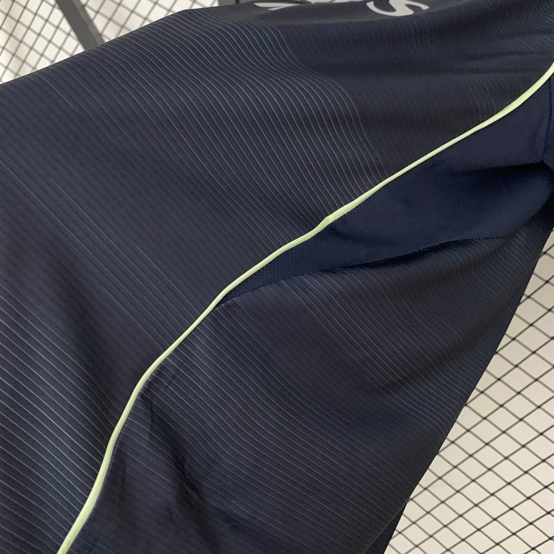 Leazofoot Real Madrid 2025-2026 away jersey in dark navy with subtle ribbed texture and neon yellow piping detail.