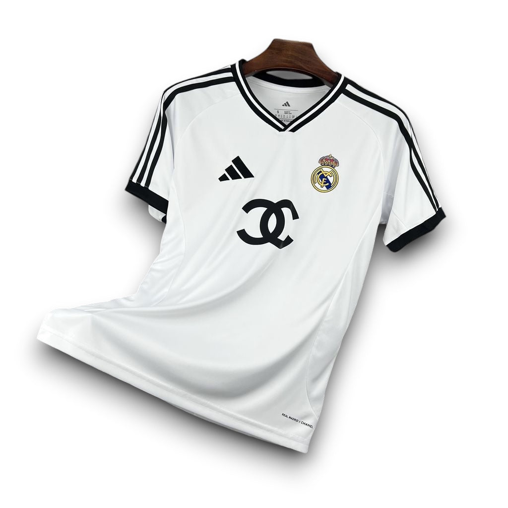 Leazofoot Real Madrid 26/27 concept football jersey in white with black trim, logo details, and V-neck design.
