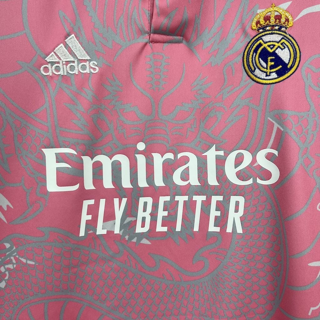 Leazofoot Real Madrid 24/25 kids concept jersey in pink with grey dragon print, Adidas logo, and team crest.