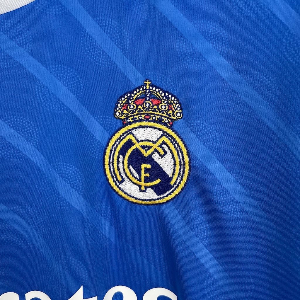 Leazofoot Real Madrid 2025-2026 third jersey featuring an embroidered club crest on a blue patterned fabric