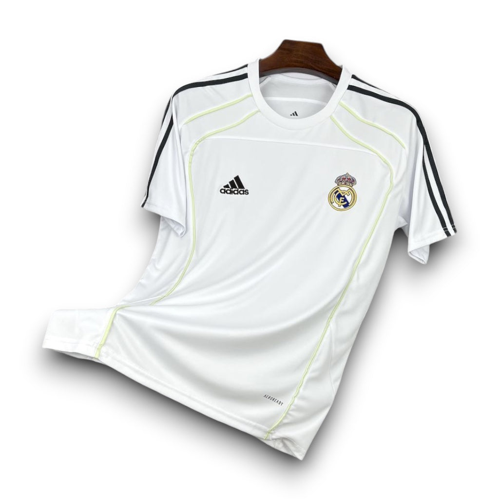 Leazofoot Real Madrid 25/26 white training jersey with black stripes and neon yellow piping details.