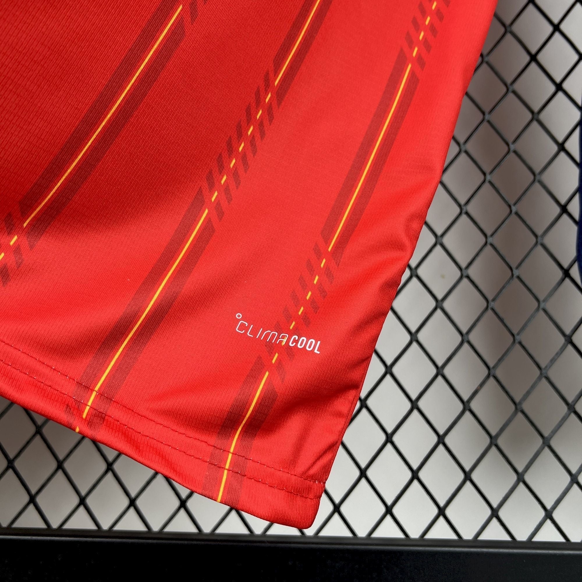 Leazofoot red long sleeve football jersey with yellow pinstripes and CLIMACOOL technology.