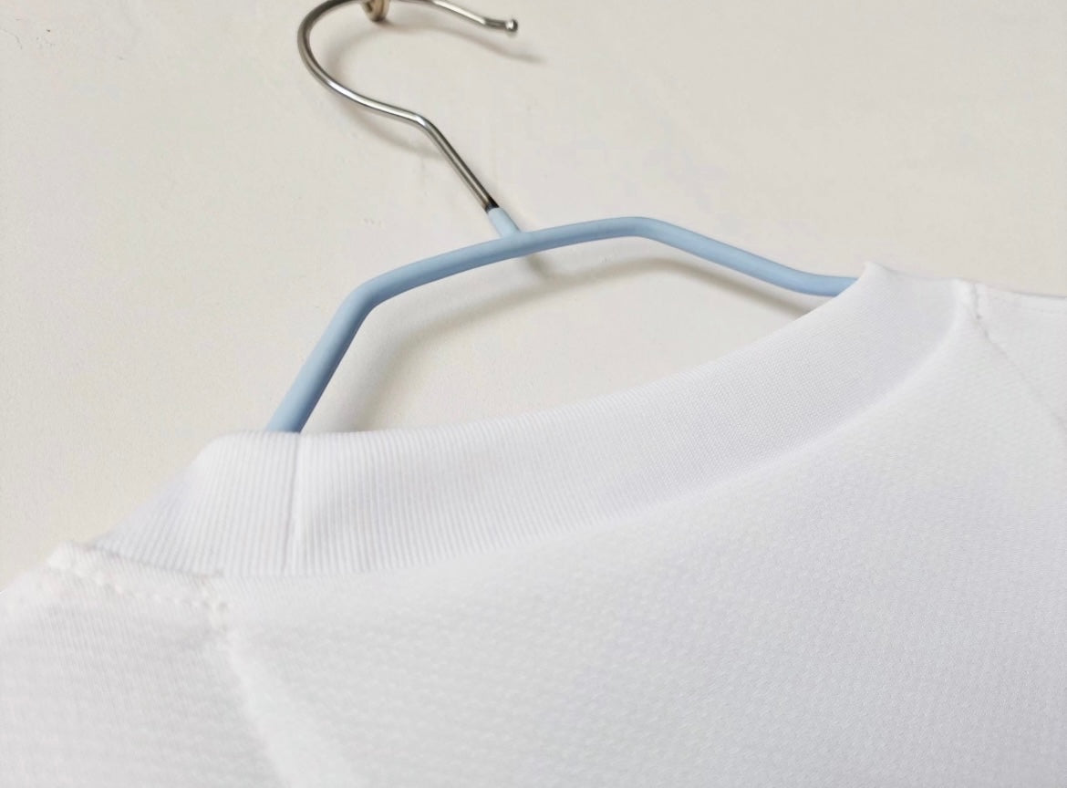 Leazofoot Santos 2012-2013 away football jersey in white with a ribbed crew neck collar on a hanger