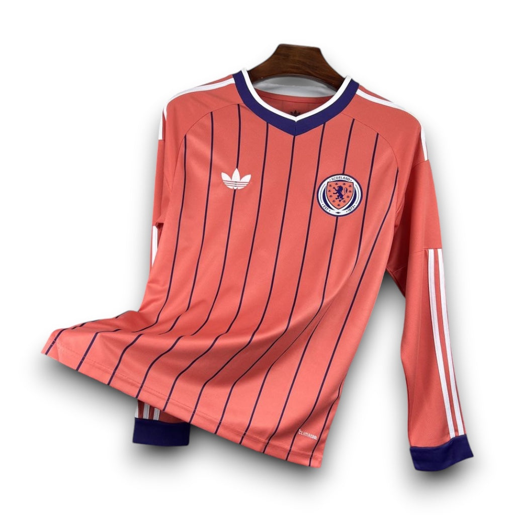Leazofoot Scotland 2026 long-sleeve away jersey in coral with navy pinstripes, white trim, and team crest.