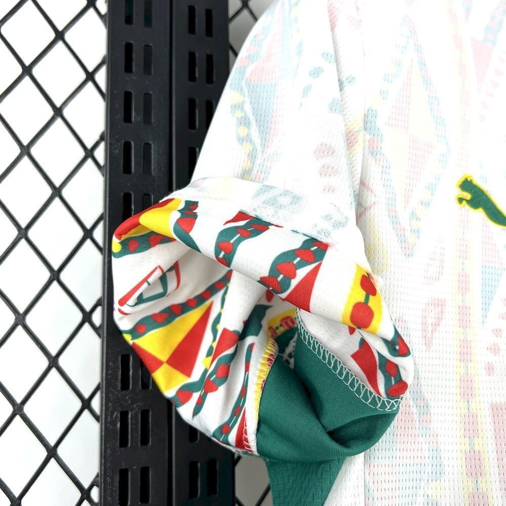 Leazofoot Senegal 2026 home football jersey featuring white fabric with vibrant red, yellow, and green patterned trim.