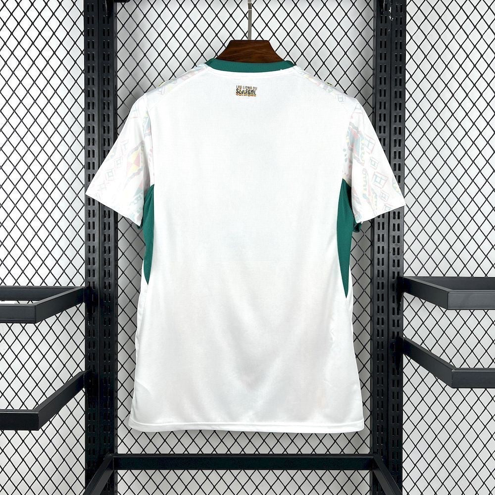 Leazofoot Senegal 2026 home football jersey in white with green accents and patterned sleeves on a display rack.
