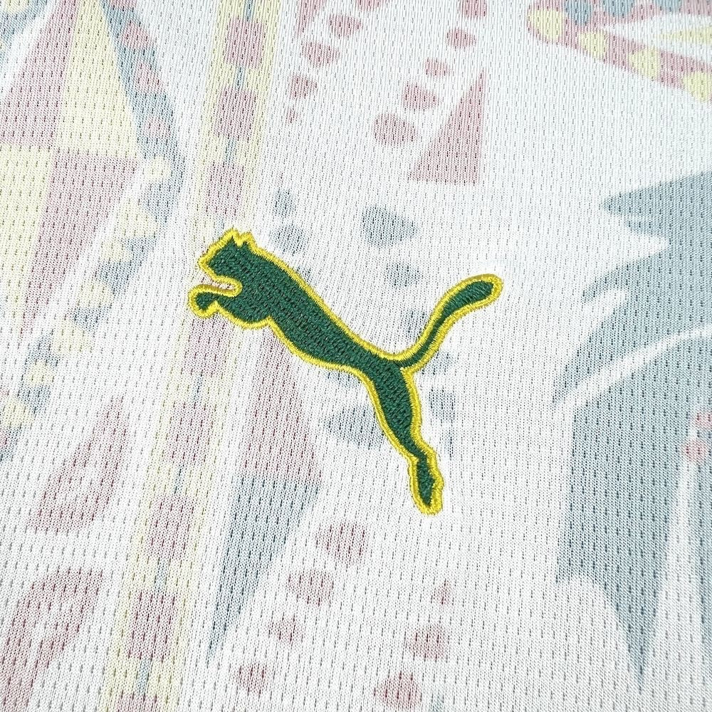Leazofoot Senegal 2026 home jersey featuring an embroidered green and yellow Puma logo on a patterned white fabric.