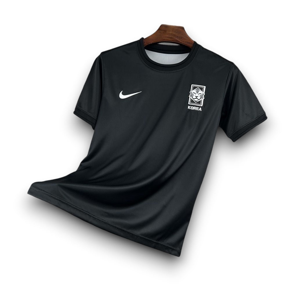 Leazofoot South Korea 2026 pre-match jersey in black with white Nike swoosh and national team crest.