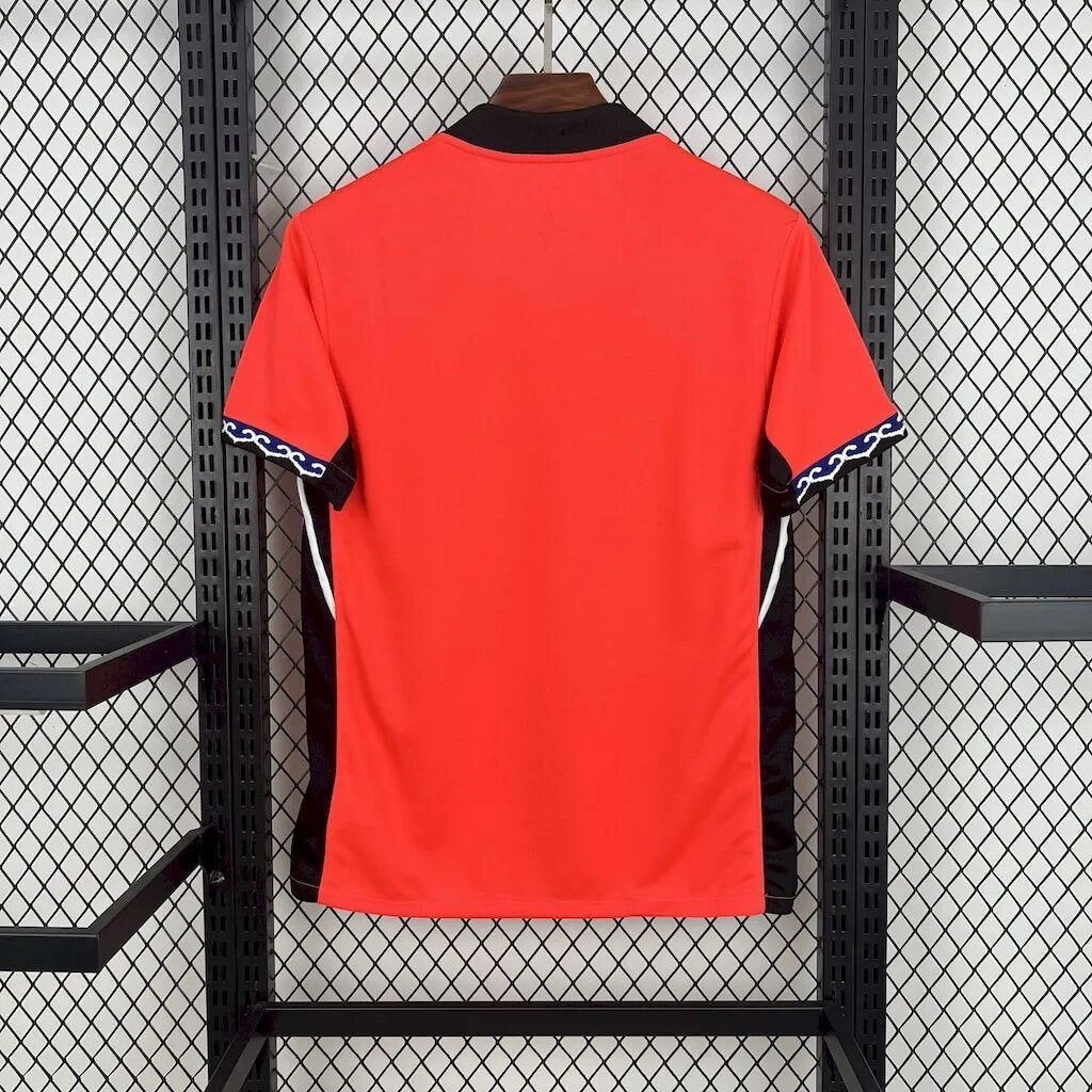 Leazofoot South Korea 2026 home jersey, red with black and white side panels and blue wave trim on sleeves.