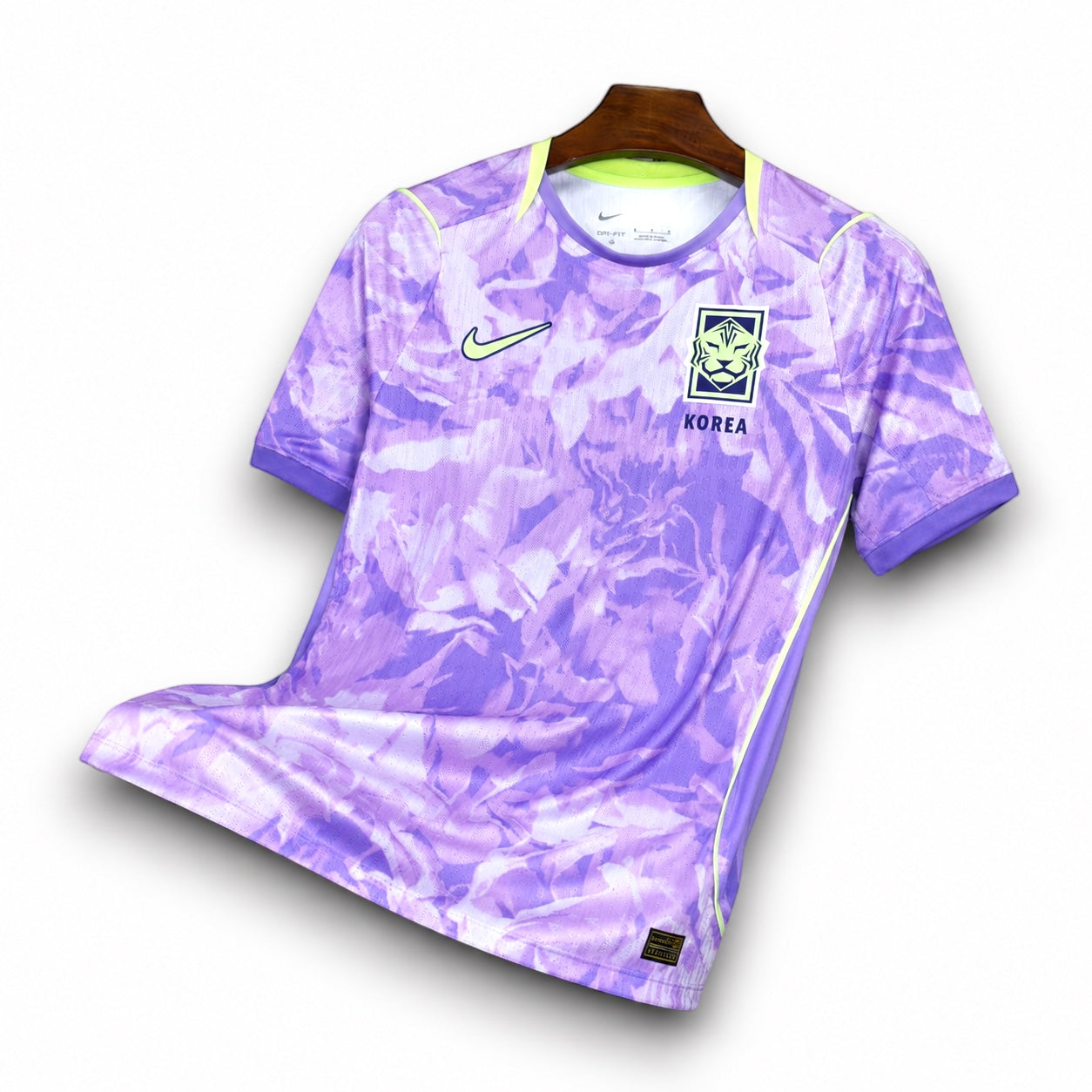Leazofoot South Korea 2026 away soccer jersey in purple with abstract floral pattern and neon yellow accents.