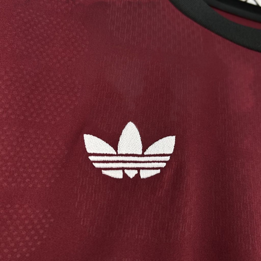 Leazofoot Spain 2026 goalkeeper jersey in dark red with a white embroidered Adidas trefoil logo and black trim.