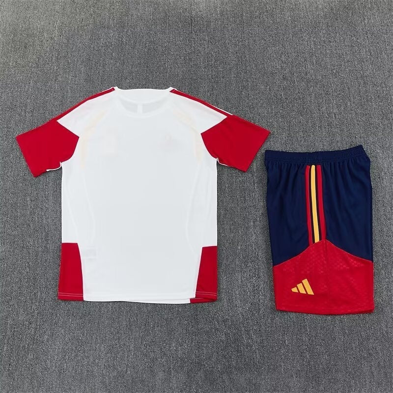 Leazofoot Spain 2026 training set featuring a white t-shirt with red accents and navy blue shorts with red details.