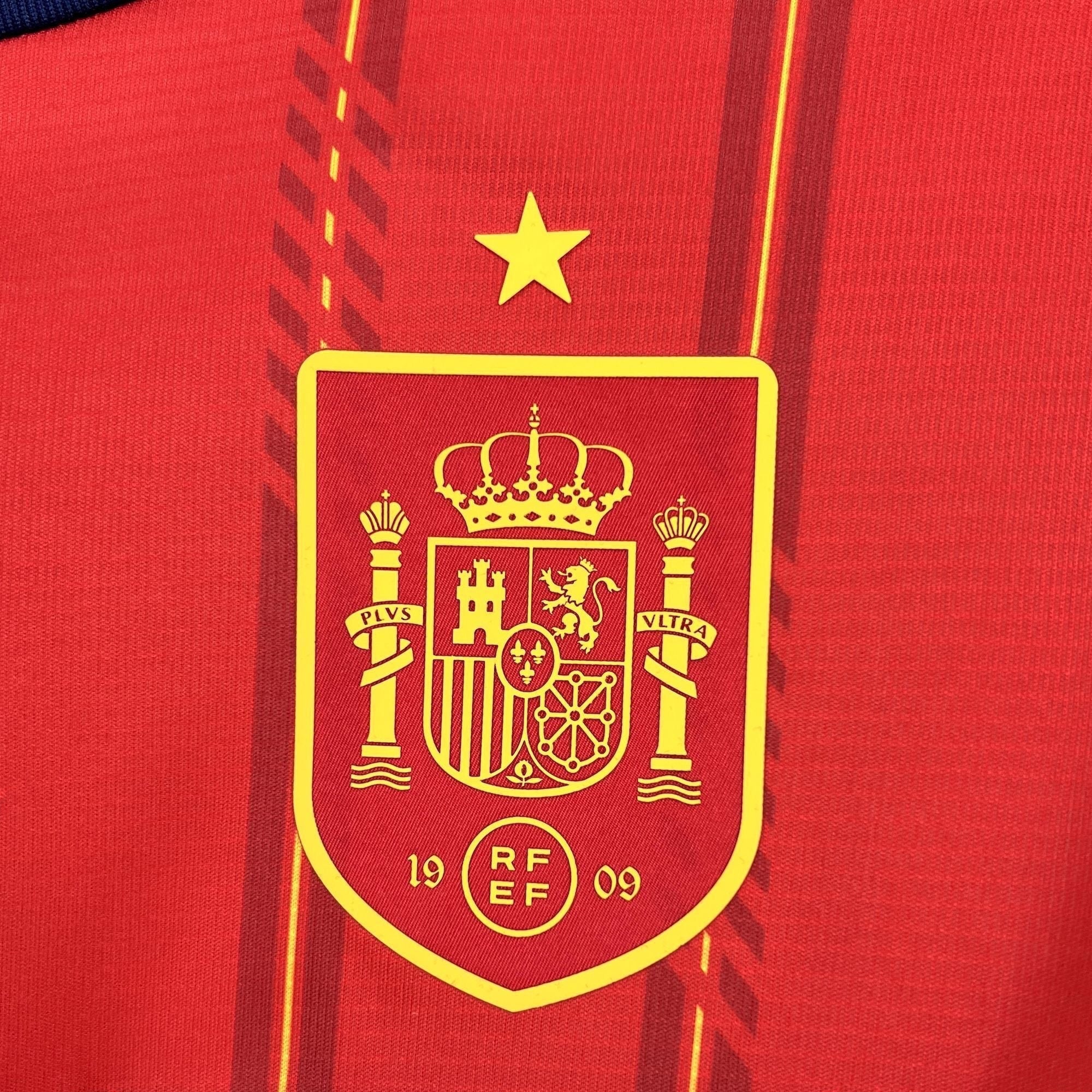 Leazofoot Spain home long sleeve football jersey 2026 with crest and star. Red with yellow accents.