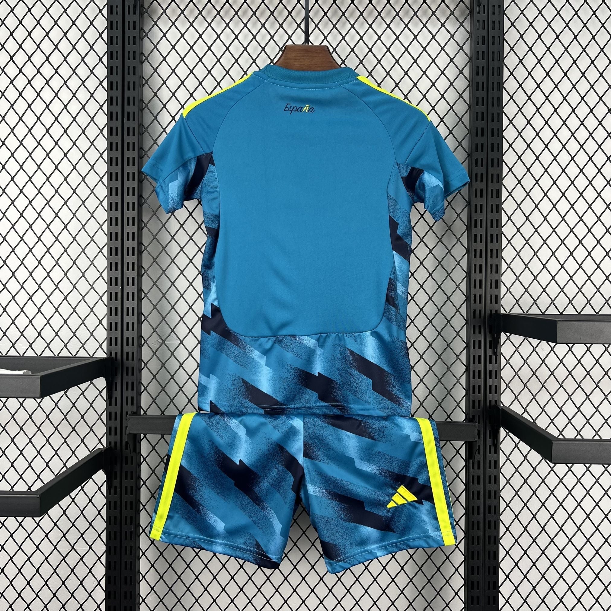 Leazofoot blue and yellow Spain goalkeeper football kit for kids, featuring a graphic print on shorts and shirt sleeves.