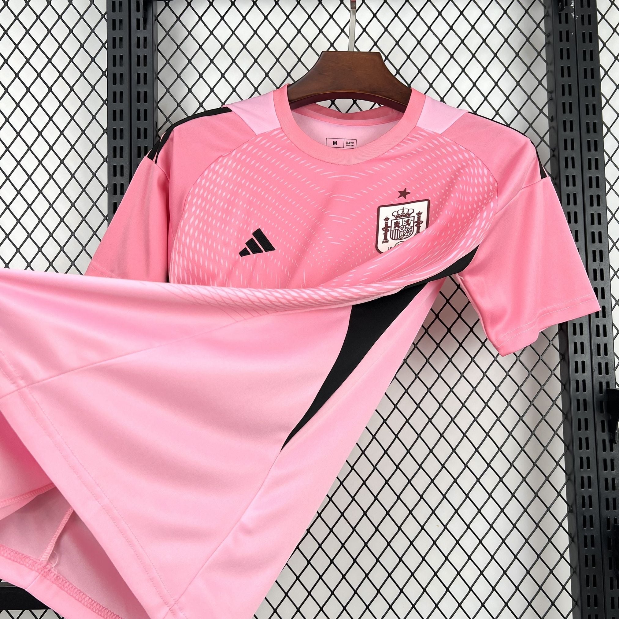 Leazofoot Spain goalkeeper jersey 2026, pink with black accents and graphic detail on sleeves.