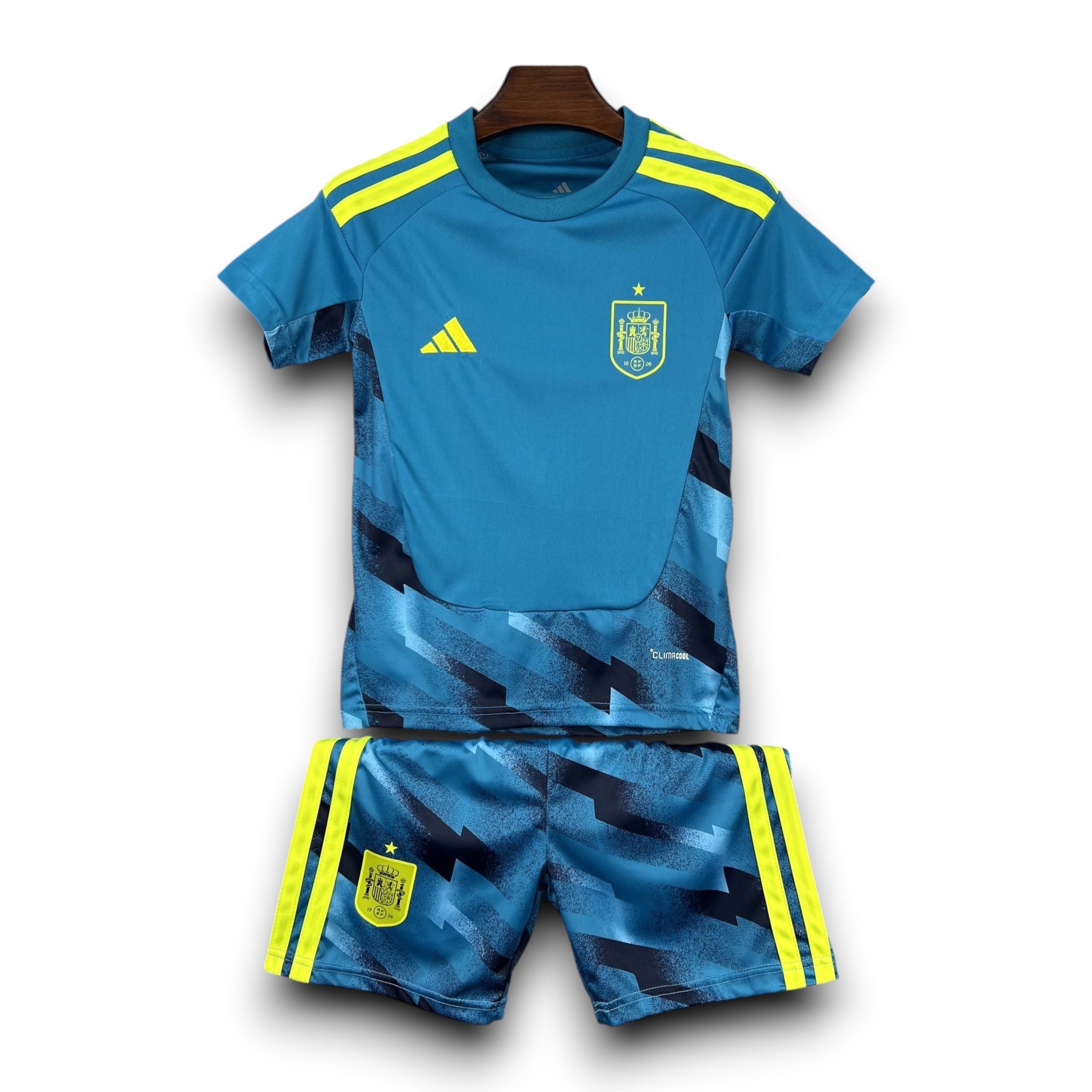 Leazofoot Spain goalkeeper kids football kit, blue with yellow accents and abstract pattern. Includes jersey and shorts.