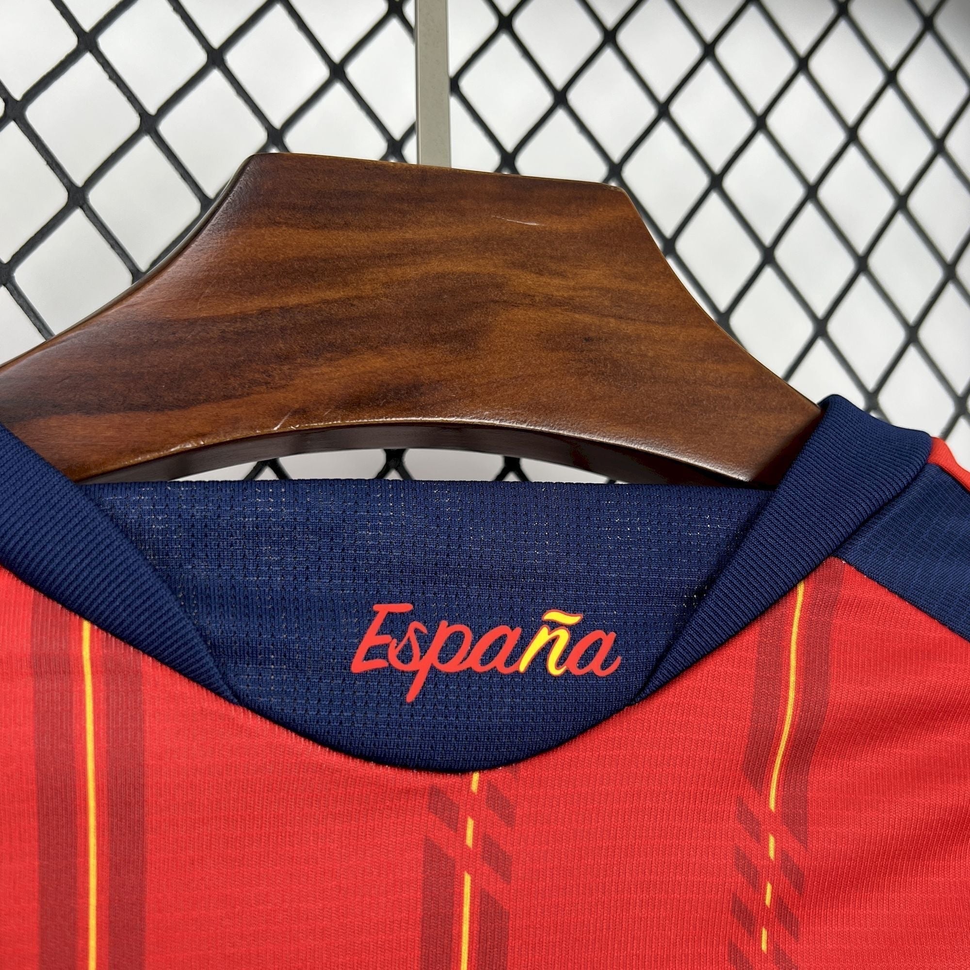 Leazofoot Spain home long sleeve football jersey 2026 in red with navy blue collar and yellow accents.