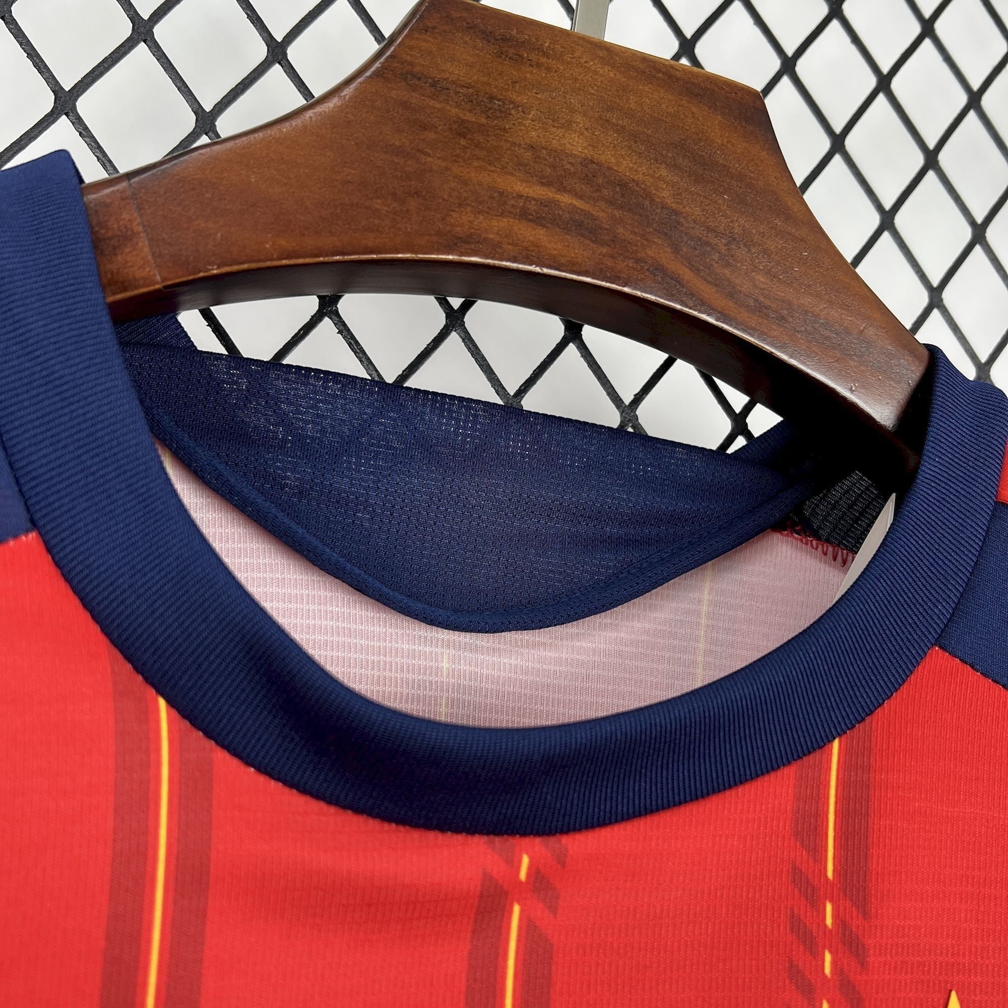 Leazofoot Spain long sleeve home jersey 2026. Red with yellow and navy accents. Features a classic crew neck.