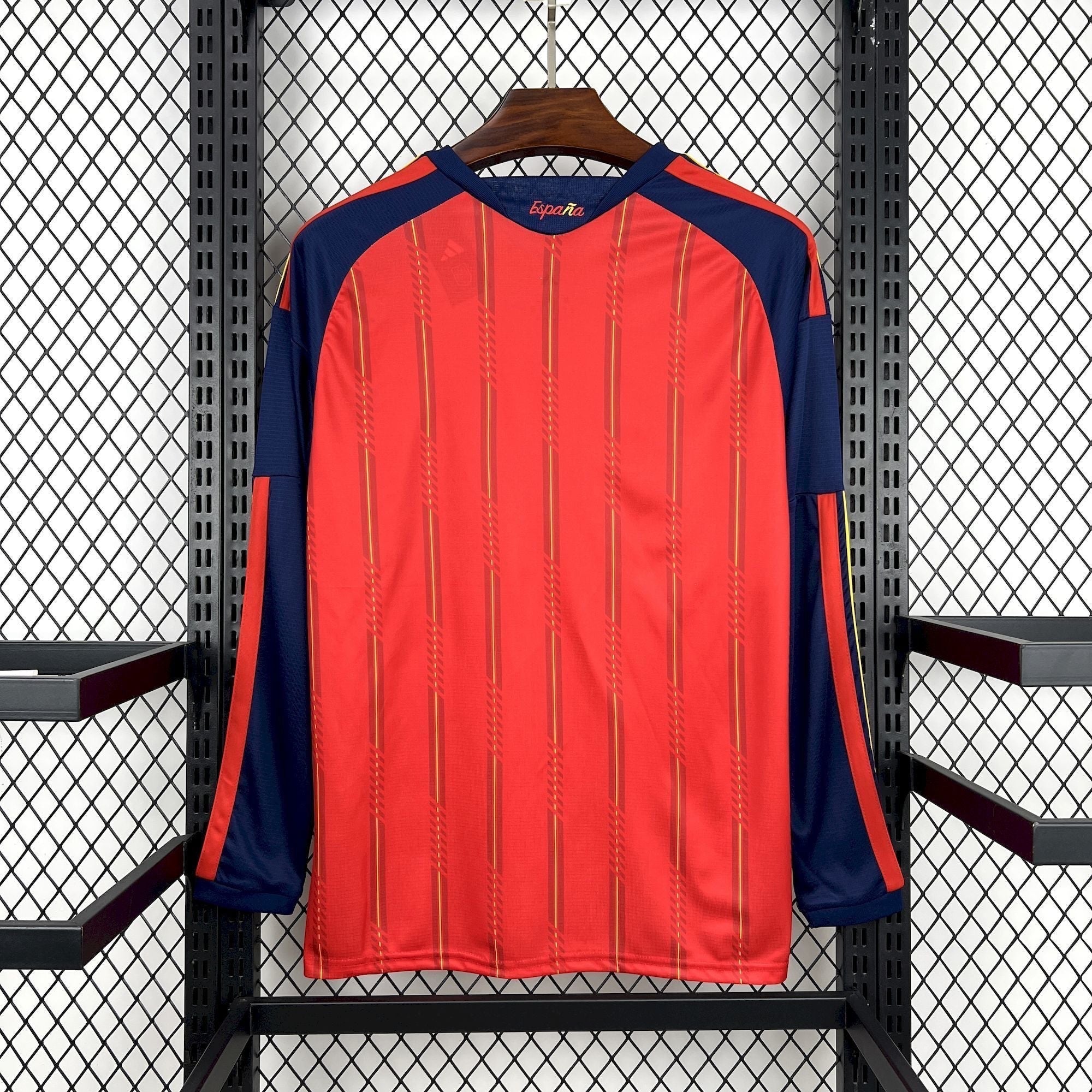 Leazofoot Spain long sleeve home soccer jersey in red with navy blue sleeves and vertical gold stripes.