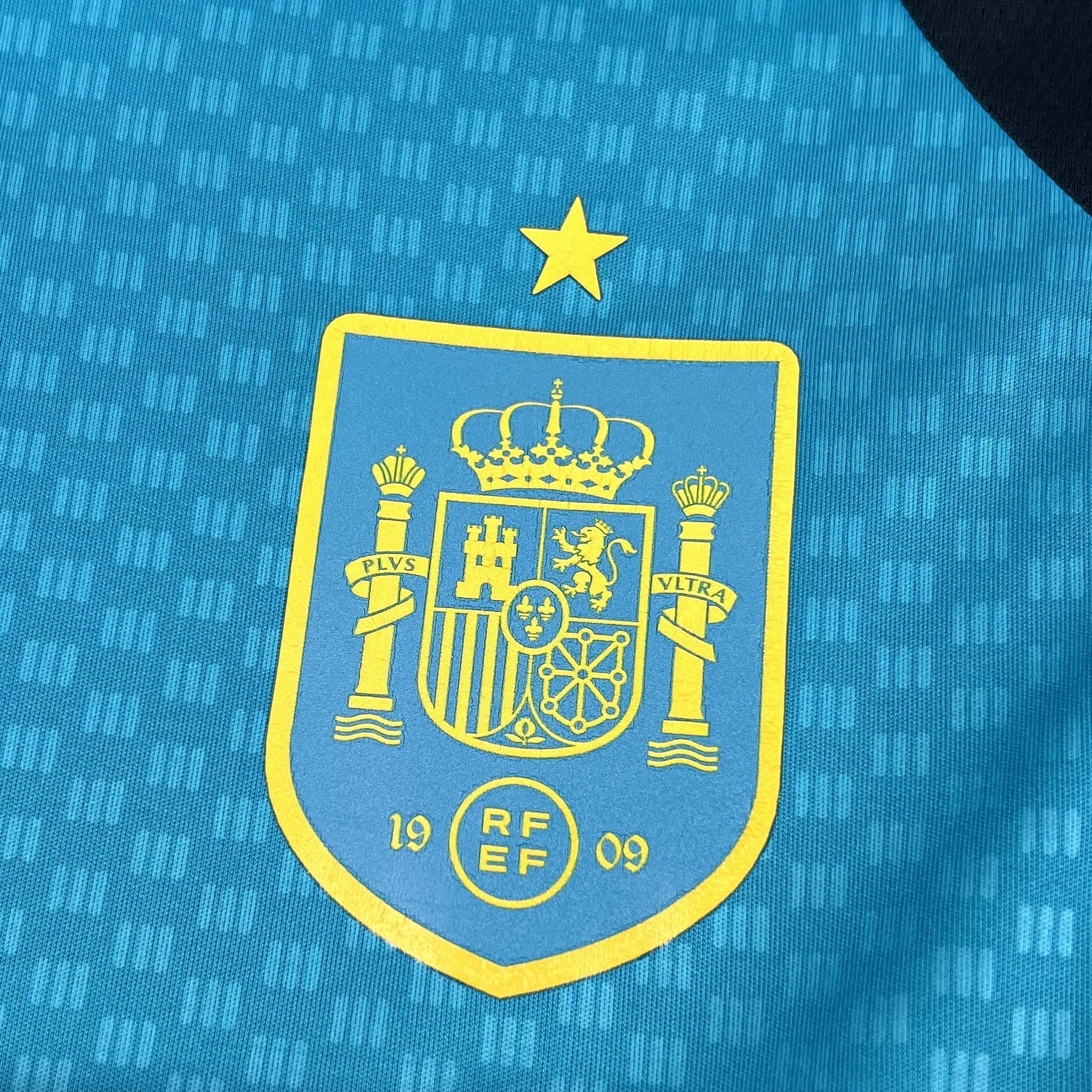 Leazofoot Spain 2026 pre-match jersey in light blue with yellow crest and star detail.