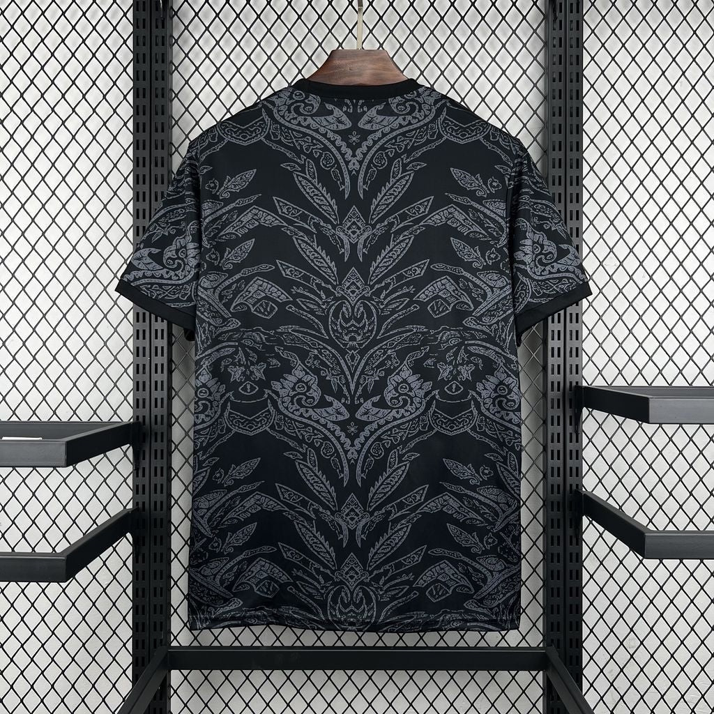 Leazofoot Sporting 25/26 goalkeeper jersey in black with a grey intricate patterned design on a hanger