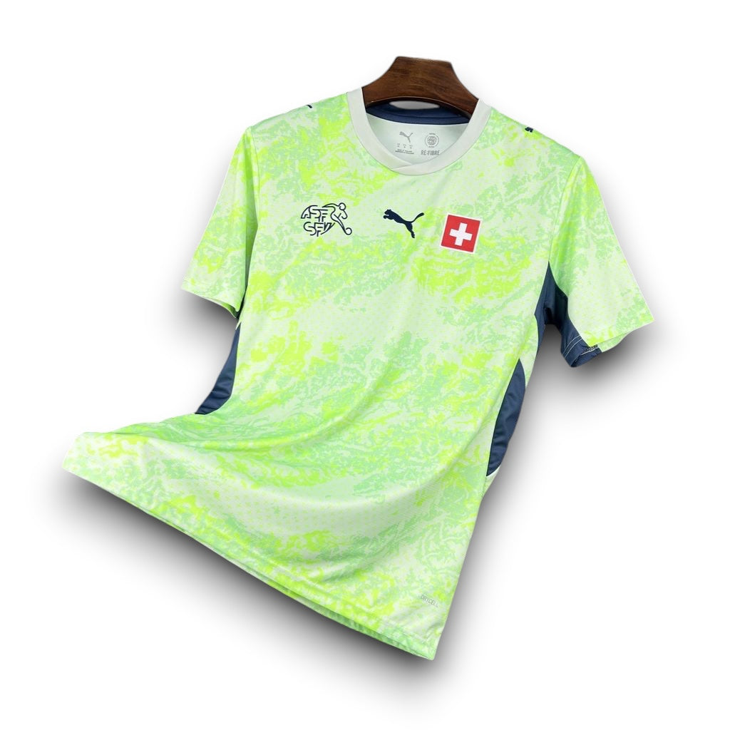 Leazofoot Switzerland 2026 away soccer jersey in neon green with mountain print, Puma logo, and Swiss flag emblem.