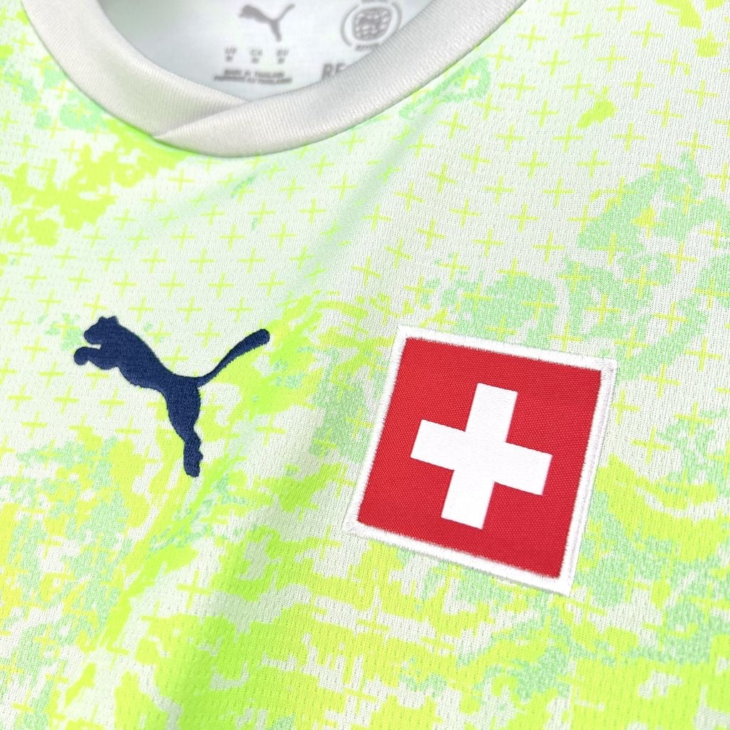 Leazofoot Switzerland 2026 away jersey in neon yellow with a subtle cross pattern and Puma logo