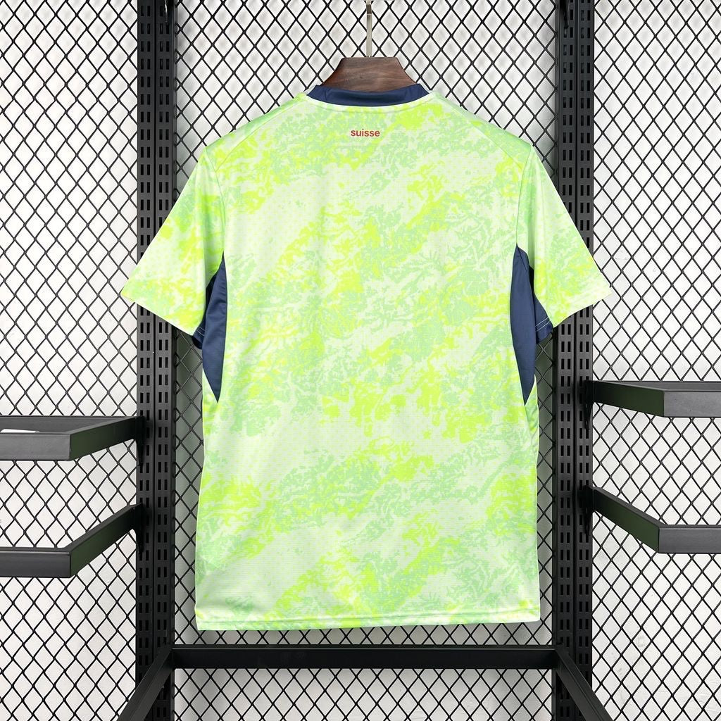 Leazofoot Switzerland 2026 away jersey in neon green with abstract pattern and dark blue side panels.