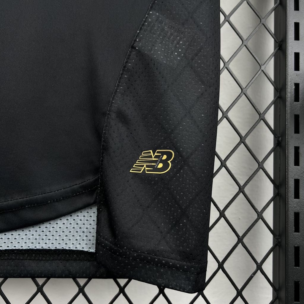 Leazofoot Toluca 26/27 concept jersey in black with gold New Balance logo and textured mesh side panel detail.