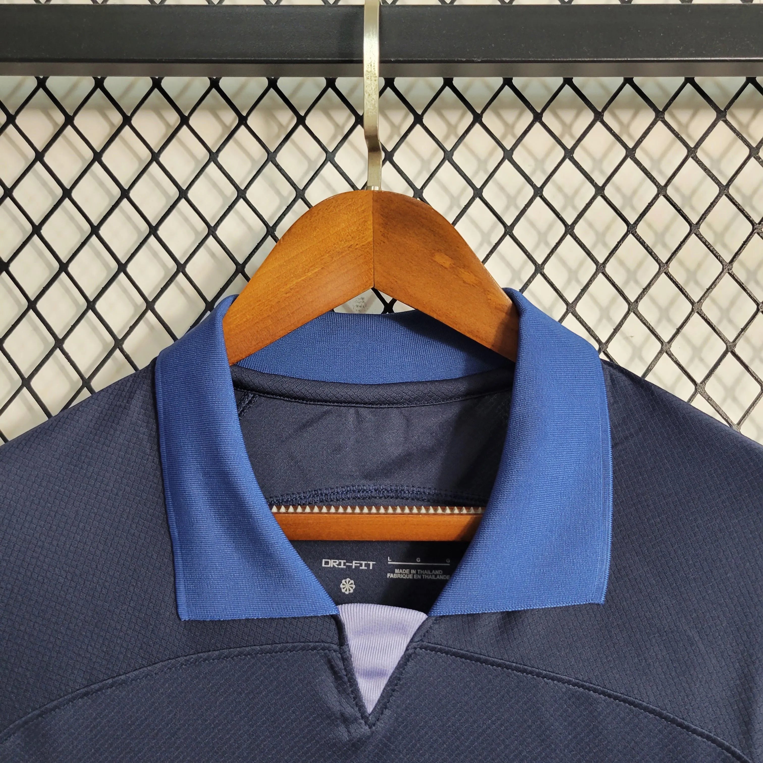 Leazofoot Tottenham 23/24 dark blue football jersey with blue collar and Dri-FIT technology.