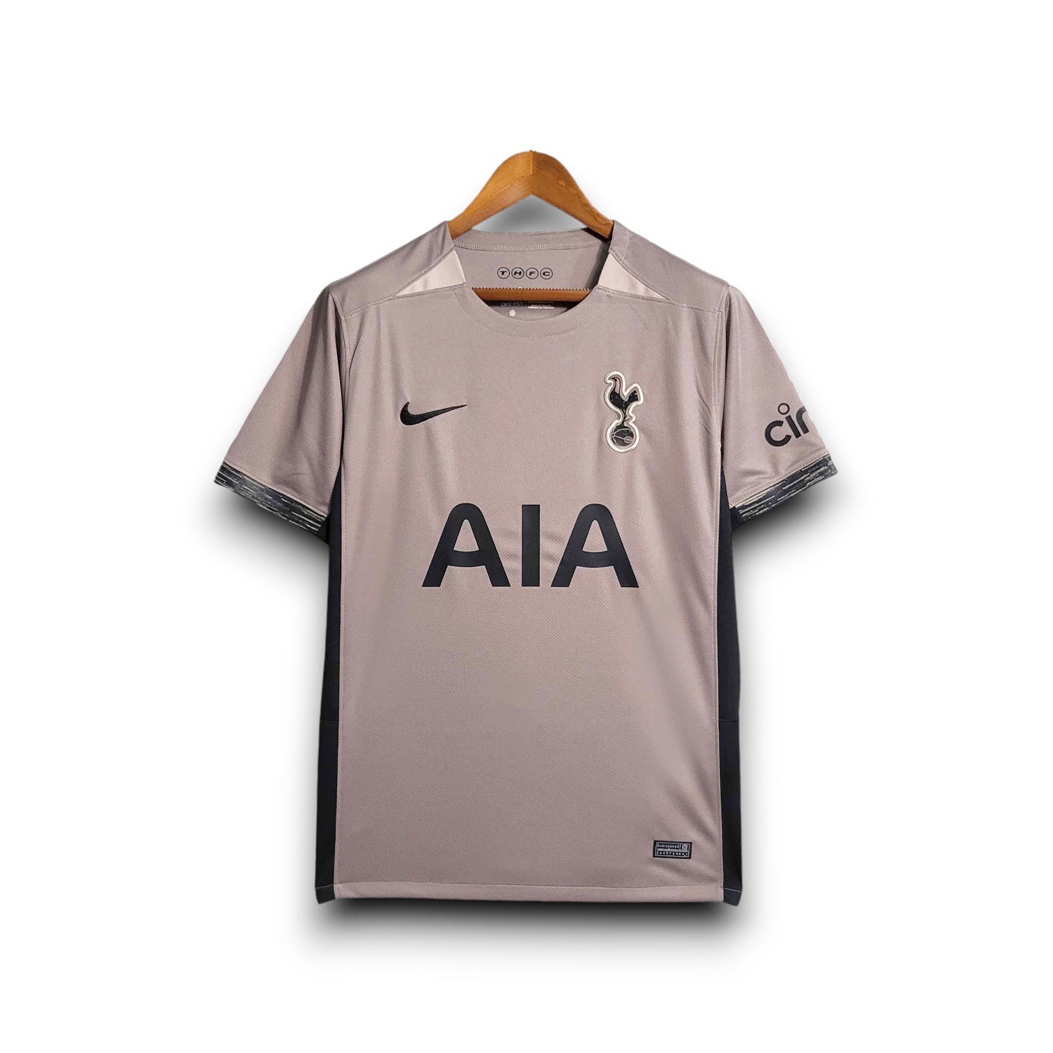 Leazofoot Tottenham Hotspur 23/24 third kit jersey in taupe with black AIA sponsor and Nike logo.