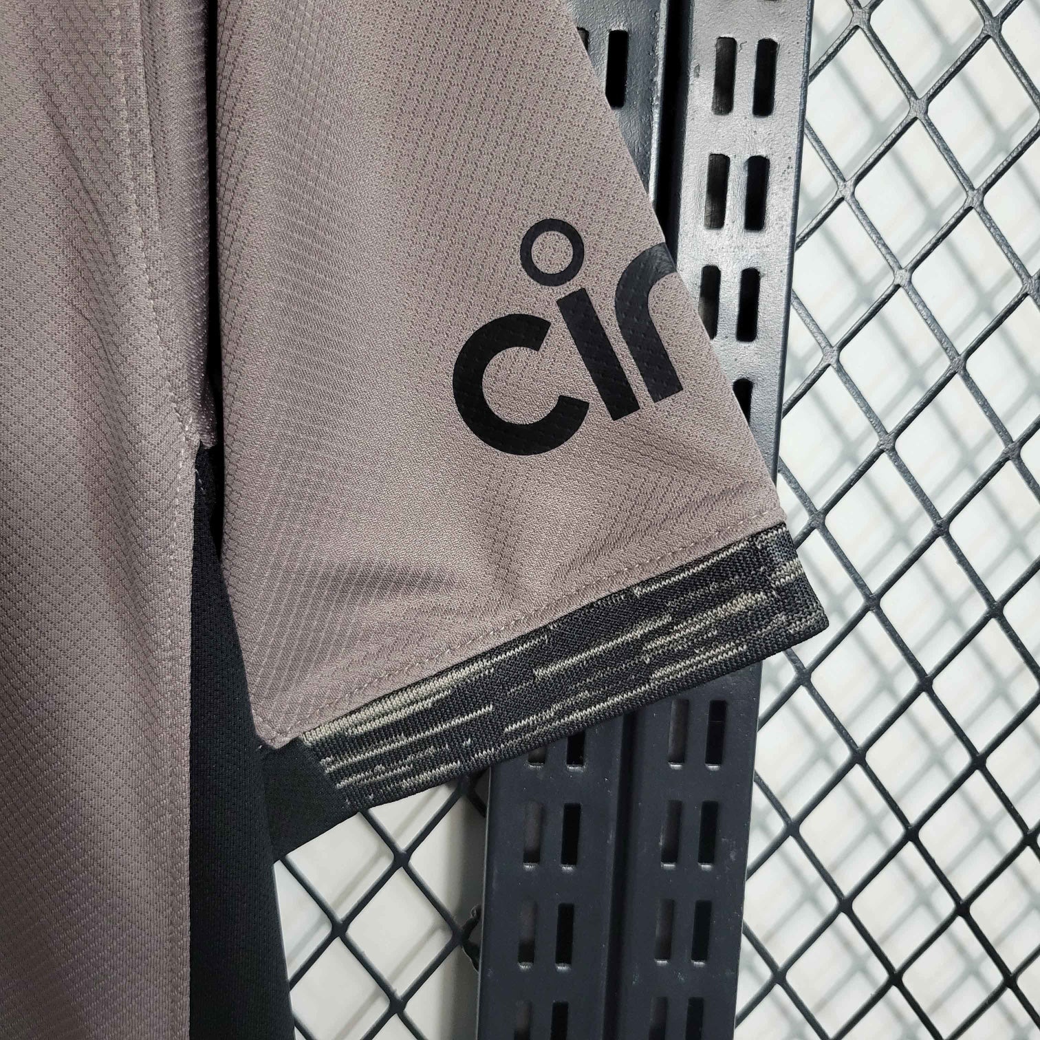 Leazofoot Tottenham 23/24 third kit jersey in taupe with black accents and cinched logo on sleeve.