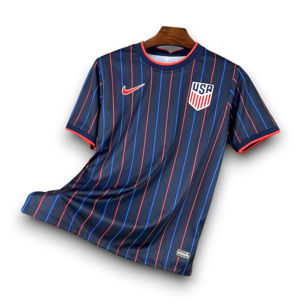 Leazofoot USA 2025 away soccer jersey in navy blue with red and blue vertical pinstripes and team crest.