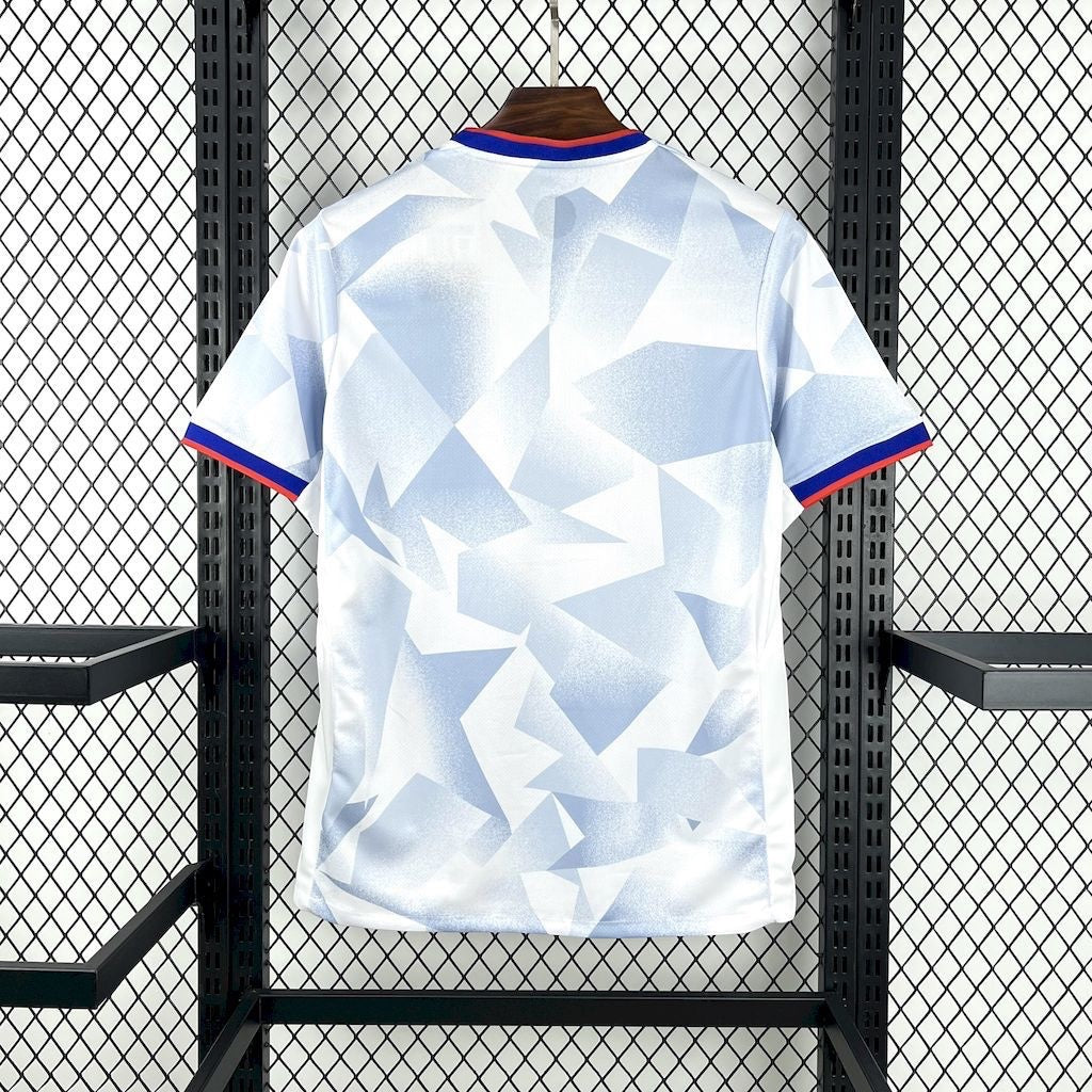 Leazofoot USA 2025 home soccer jersey in white with a blue geometric pattern and red and blue sleeve trim.