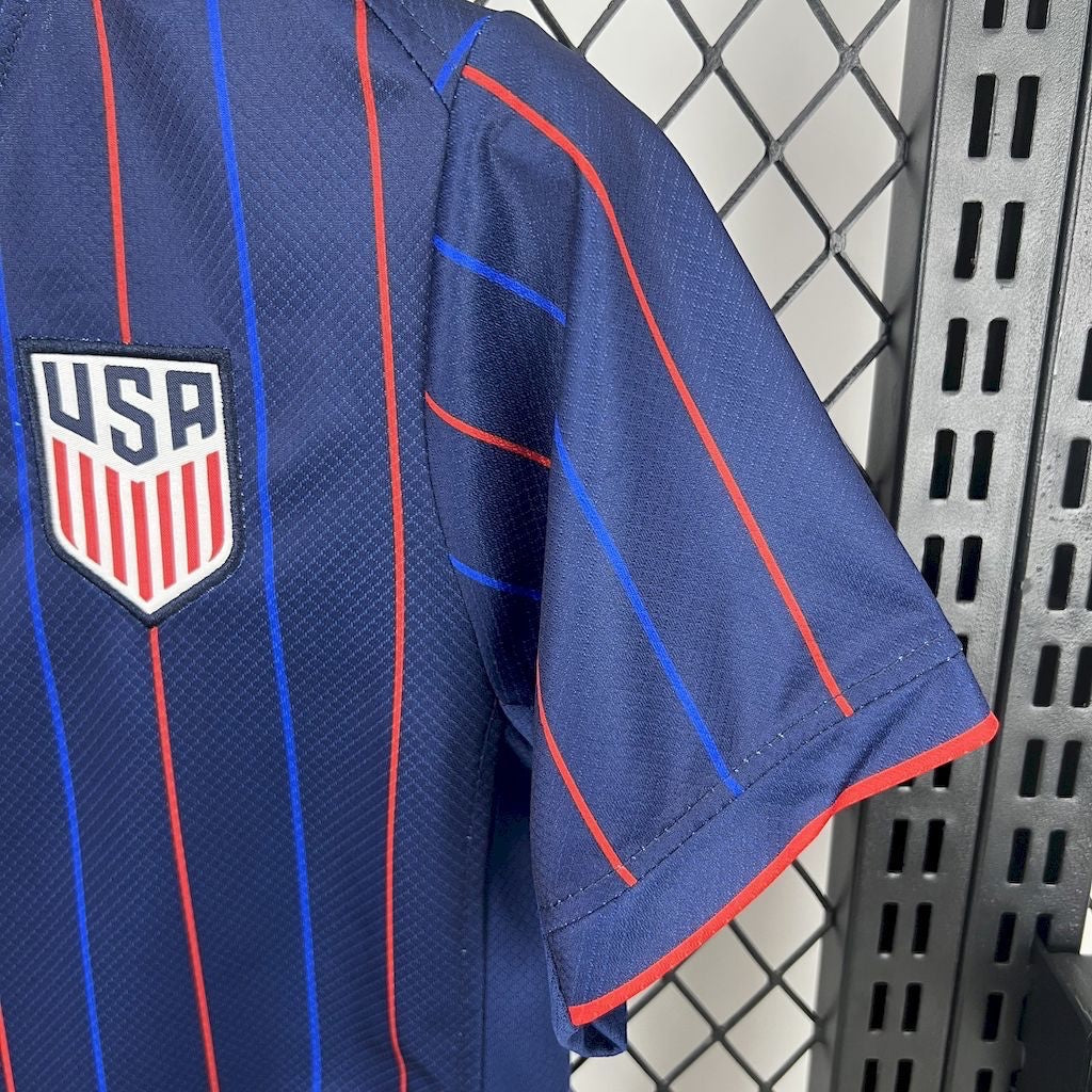 Leazofoot 2025 USA kids away soccer jersey in navy blue with red and blue vertical pinstripes and team crest.