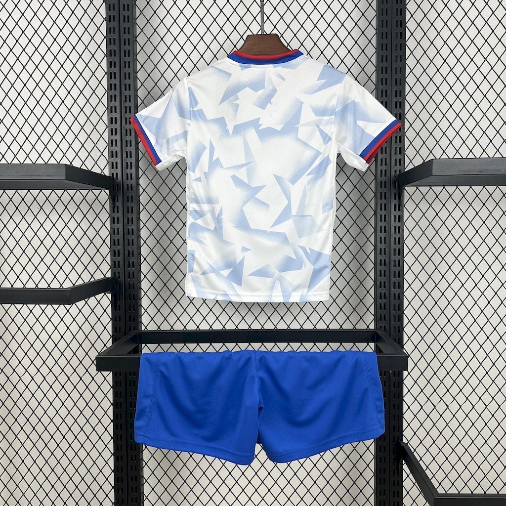 Leazofoot 2025 USA kids home soccer kit featuring a white jersey with blue geometric pattern and blue shorts.