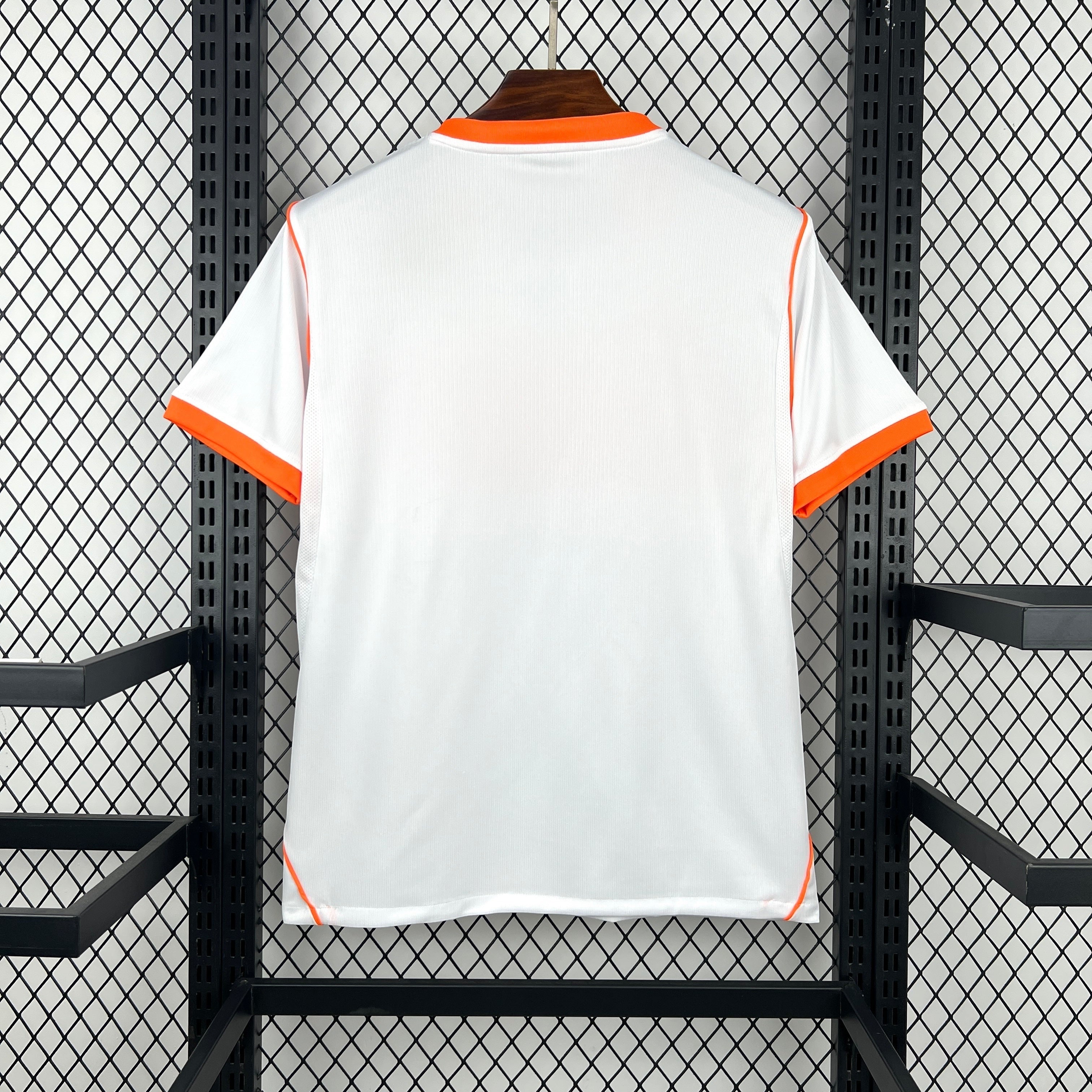 Leazofoot white football jersey with orange trim on collar and sleeves, 2026 away kit.